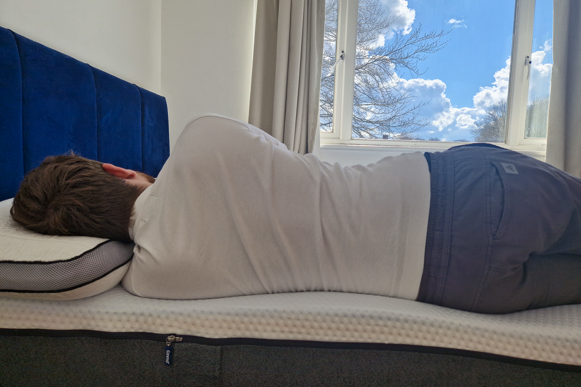 man sleeping on emma premium